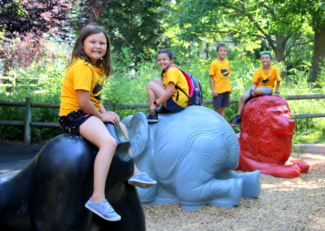 Campers on zoo animal statues
