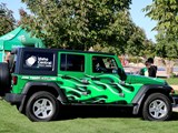 A sponsor's decorated vehicle at an event