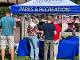 The Meridian Parks and Recreation pop up tent during the Fourth of July Celebration