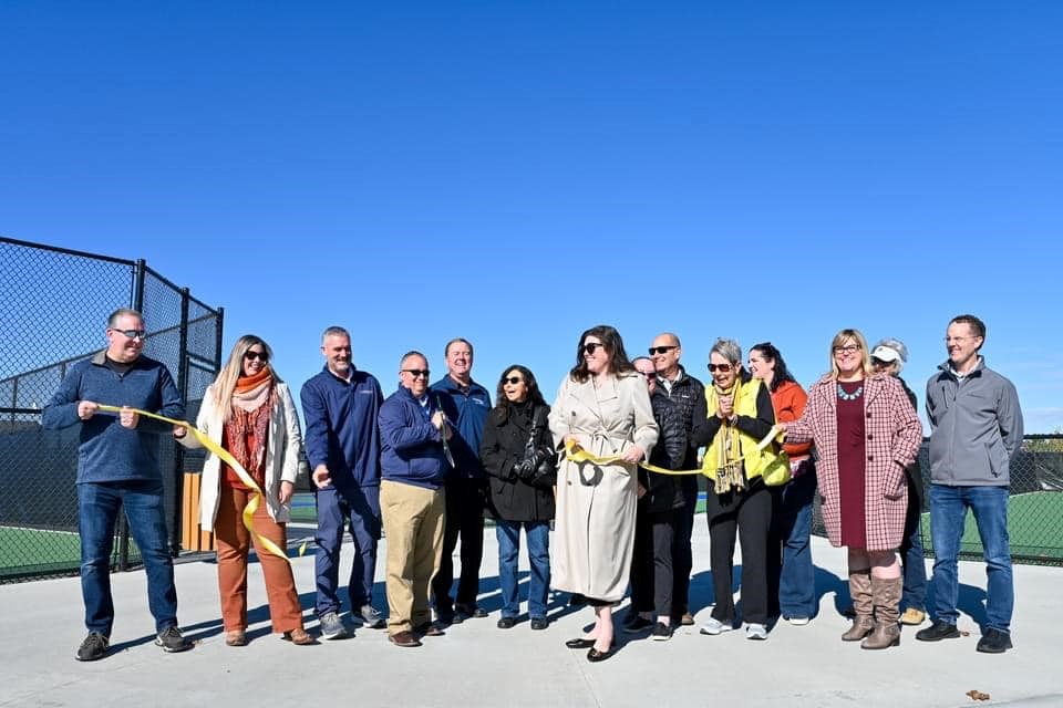 Group photo of a park ribbon cutting
