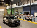 The Youth Safety Academy in the MPD Scenario Village checking out a patrol car. 