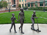 Bronze statues of children in front of City Hall
