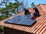 Solar panels being installed on a roof