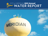 Meridian Water Tower up close with blue sky and clouds with the words "City of Meridian 2022 Annual Water Report"