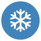 A white snowflake on a blue background circle