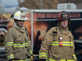 two firefighters walking together